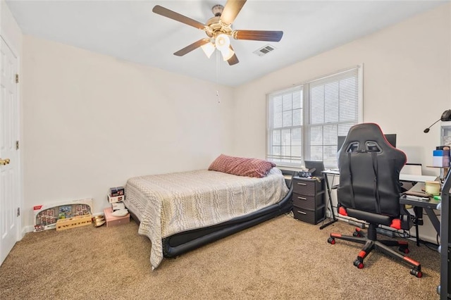 bedroom featuring visible vents, ceiling fan, and carpet flooring