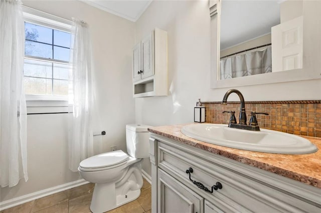 full bath with vanity, crown molding, tile patterned floors, toilet, and backsplash