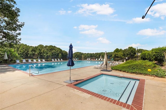 community pool with a patio area