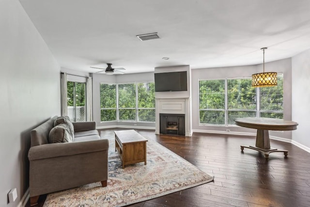 244 13th St NE Unit 302, Atlanta, GA 30309 - living area with a ceiling fan, a fireplace, and wood-type flooring