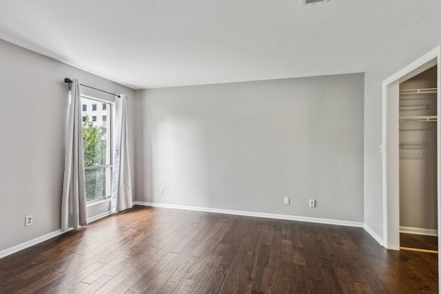 244 13th St NE Unit 302, Atlanta, GA 30309 - unfurnished bedroom featuring dark wood-style floors and a closet