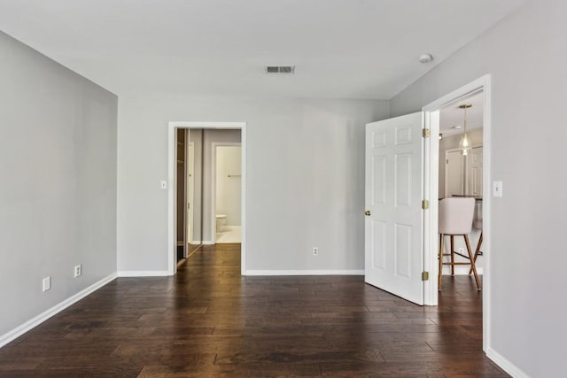 244 13th St NE Unit 302, Atlanta, GA 30309 - unfurnished room featuring dark wood finished floors and a smoke detector
