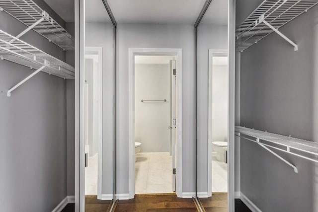 244 13th St NE Unit 302, Atlanta, GA 30309 - spacious closet with dark wood-style flooring