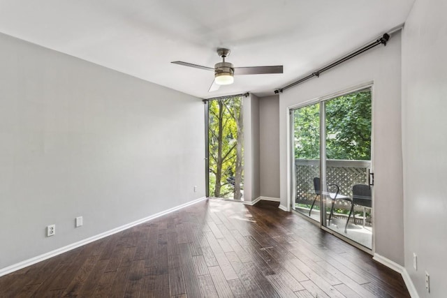 244 13th St NE Unit 302, Atlanta, GA 30309 - spare room with a ceiling fan and dark wood-style flooring