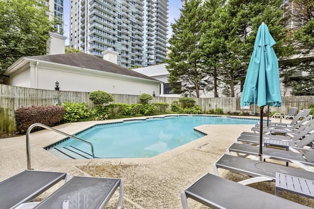 244 13th St NE Unit 302, Atlanta, GA 30309 - community pool featuring a patio and a fenced backyard