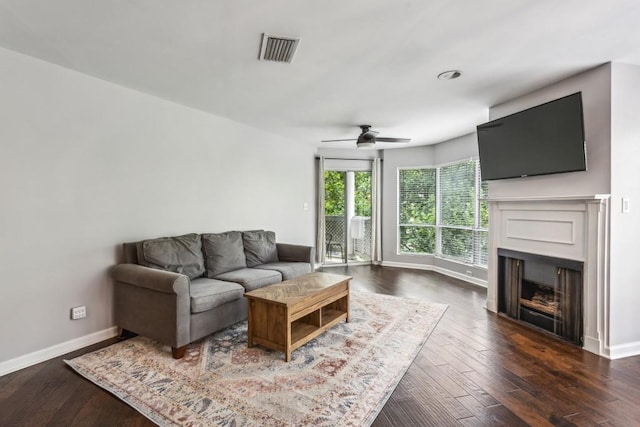 244 13th St NE Unit 302, Atlanta, GA 30309 - living room featuring ceiling fan, a fireplace, and wood finished floors