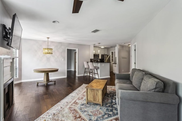 244 13th St NE Unit 302, Atlanta, GA 30309 - living room with dark wood-style floors and baseboards