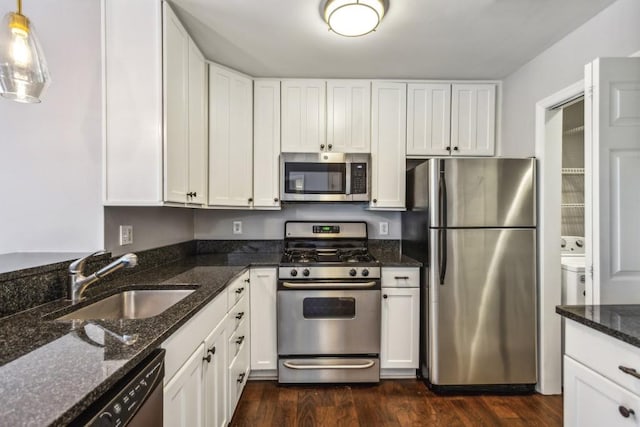 244 13th St NE Unit 302, Atlanta, GA 30309 - kitchen with appliances with stainless steel finishes, white cabinetry, and dark wood-style flooring