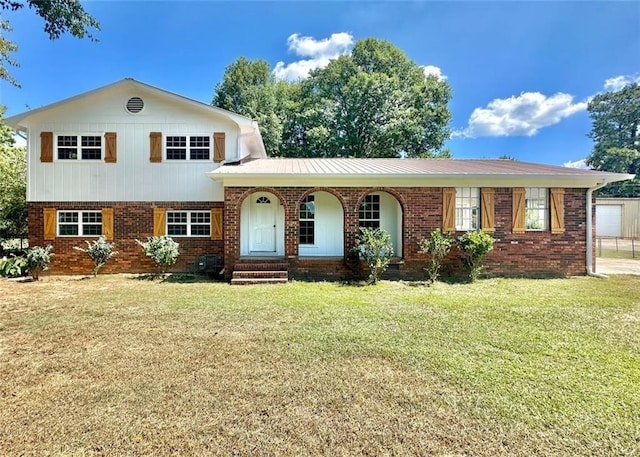 split level home with a front yard