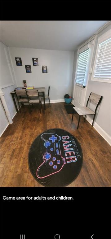 living area featuring hardwood / wood-style floors