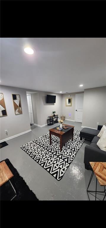 living room with concrete flooring