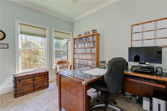 office space with baseboards, crown molding, and light colored carpet