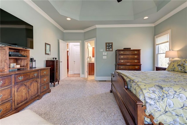 bedroom with a tray ceiling, light colored carpet, crown molding, and baseboards