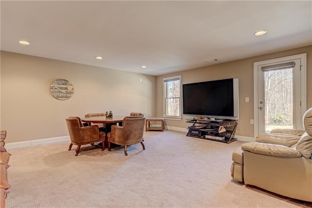 dining area featuring light carpet, baseboards, a wealth of natural light, and recessed lighting