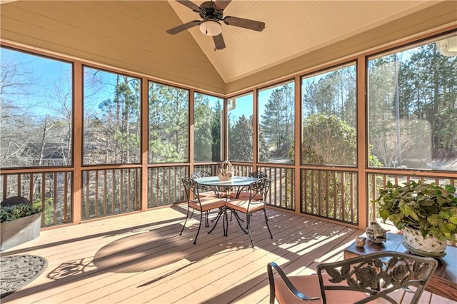 sunroom featuring a ceiling fan and vaulted ceiling