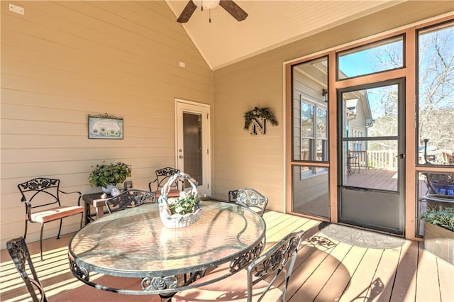 sunroom featuring vaulted ceiling, a wealth of natural light, and a ceiling fan