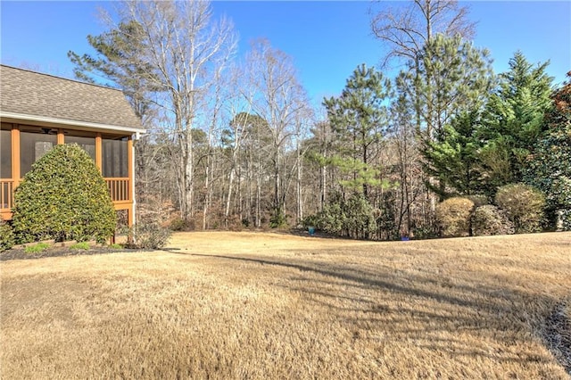 view of yard with a sunroom