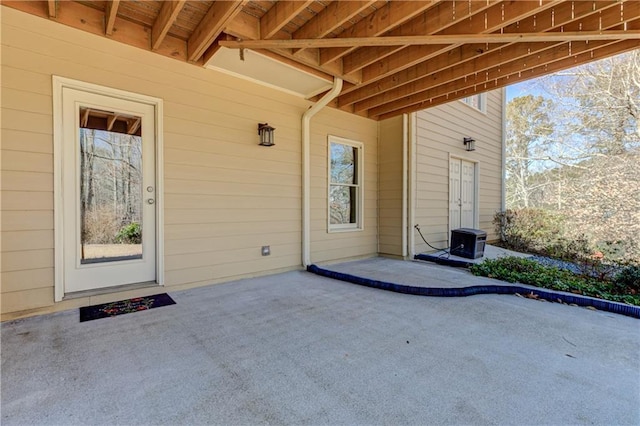 entrance to property with a patio