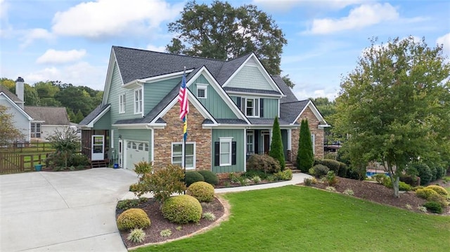 craftsman-style home with a front yard and a garage