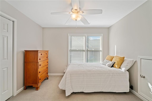 carpeted bedroom featuring ceiling fan and vaulted ceiling