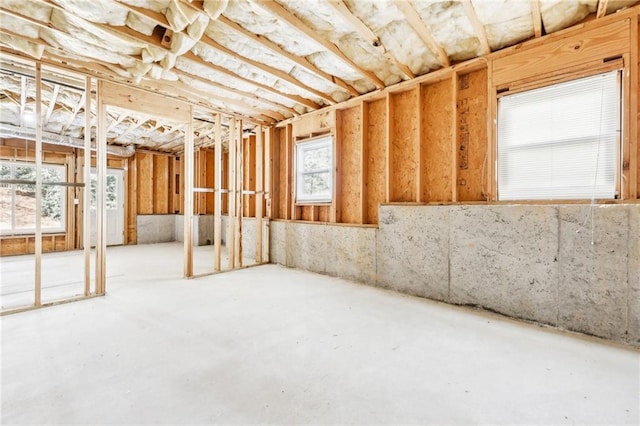 misc room with concrete floors and a healthy amount of sunlight