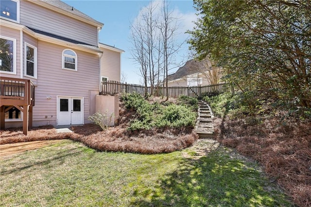 view of yard featuring stairs and fence