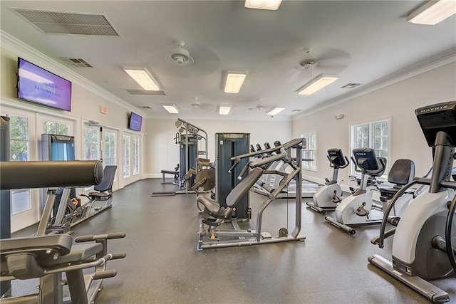 gym with visible vents, crown molding, and french doors