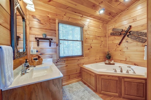 bathroom featuring wood ceiling, a garden tub, vaulted ceiling, vanity, and wooden walls