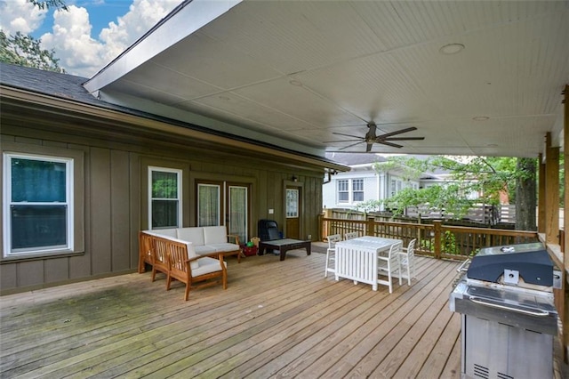 deck featuring area for grilling, an outdoor living space, and ceiling fan