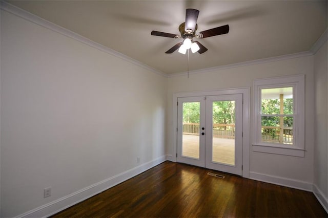 spare room featuring french doors, crown molding, dark wood-type flooring, and ceiling fan