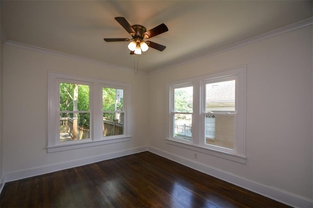 empty room with ceiling fan, dark wood-type flooring, and crown molding