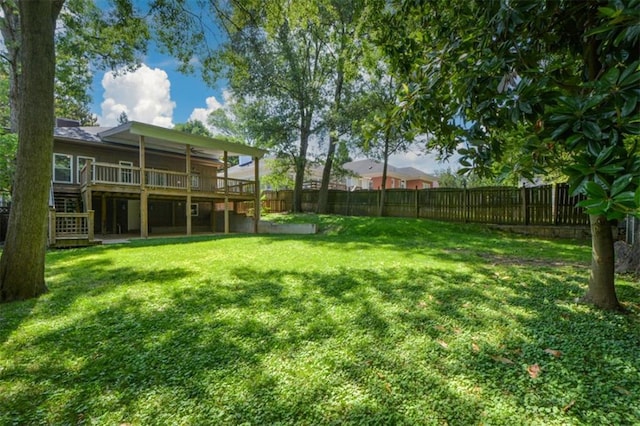 view of yard with a wooden deck