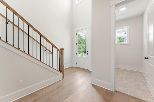 foyer with light hardwood / wood-style flooring and plenty of natural light