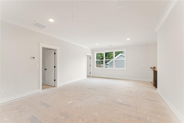 spare room with crown molding