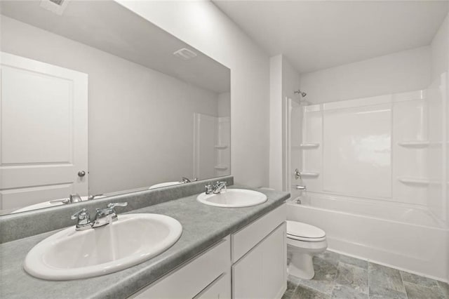 full bathroom with bathing tub / shower combination, vanity, and toilet