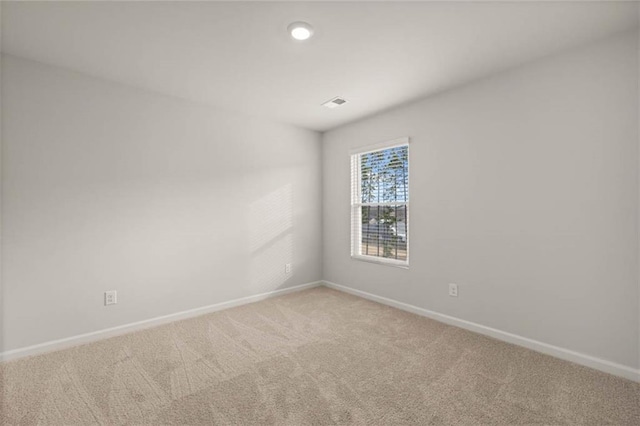 empty room featuring carpet flooring