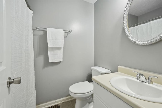 full bathroom with vanity and toilet