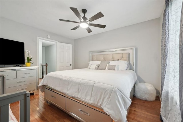 bedroom with a ceiling fan and wood finished floors