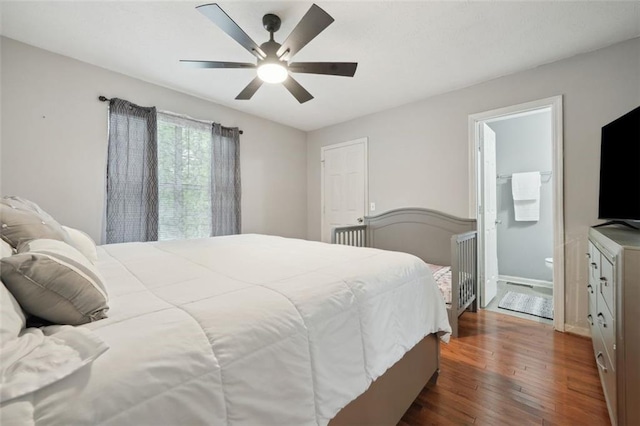 bedroom featuring baseboards, dark wood-style floors, and ceiling fan
