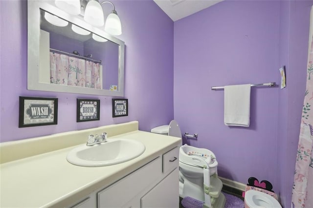 full bath featuring vanity, toilet, and visible vents