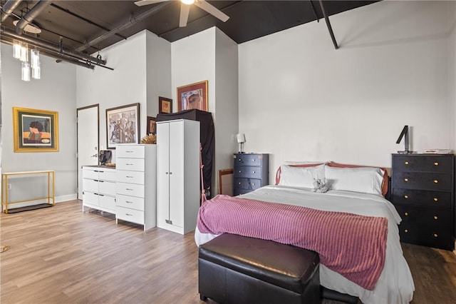 120 Ralph Mcgill Blvd NE Unit 1409, Atlanta, GA 30308 - bedroom with wood finished floors, a towering ceiling, and ceiling fan