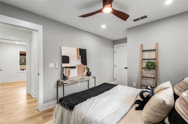 bedroom with recessed lighting, light wood-style flooring, baseboards, and ceiling fan