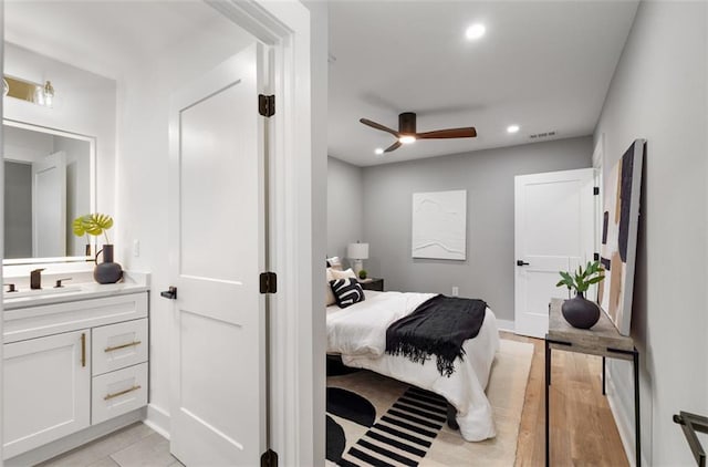 bedroom with a sink, recessed lighting, and a ceiling fan