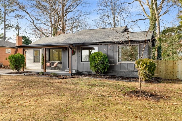 view of front of property featuring roof with shingles