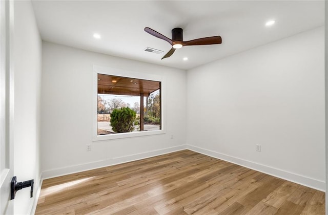 spare room with light wood-style flooring, a ceiling fan, recessed lighting, and baseboards