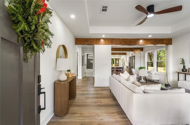 living area with a ceiling fan, light wood-type flooring, recessed lighting, and baseboards