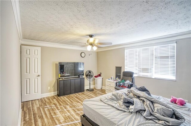 6414 Wedgewood Trce, Tucker, GA 30084 - bedroom with ceiling fan, light wood-type flooring, ornamental molding, and a textured ceiling