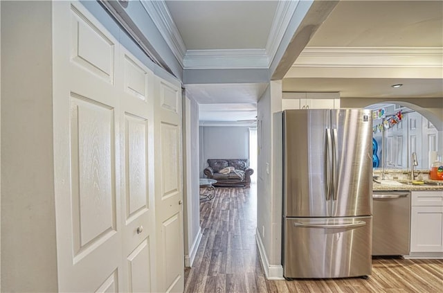 6414 Wedgewood Trce, Tucker, GA 30084 - kitchen with white cabinetry, sink, light stone countertops, light hardwood / wood-style flooring, and appliances with stainless steel finishes
