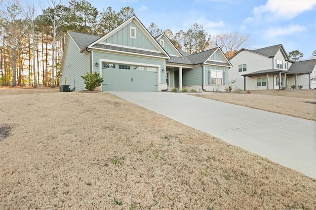 view of front of home with board and batten siding, concrete driveway, and a garage