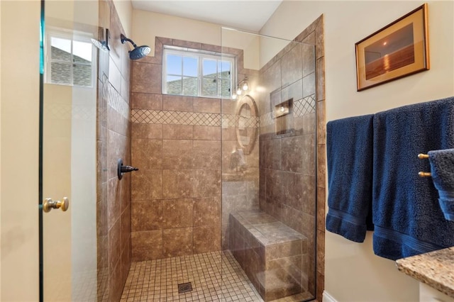 bathroom with tiled shower